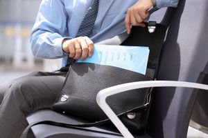 Businessman sitting on a chair with briefcase and getting out property management documents with enforcement judgment